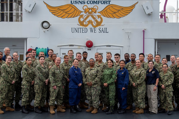 Naval officers, including dentists, aboard the USNS Comfort